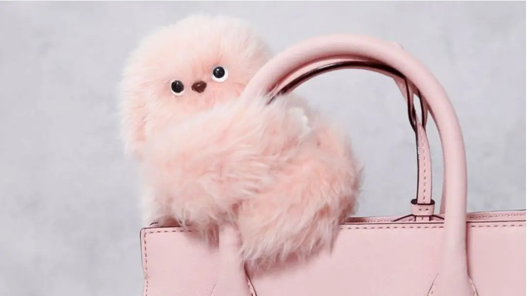 Pink Mirumi robot on handbag - TMM