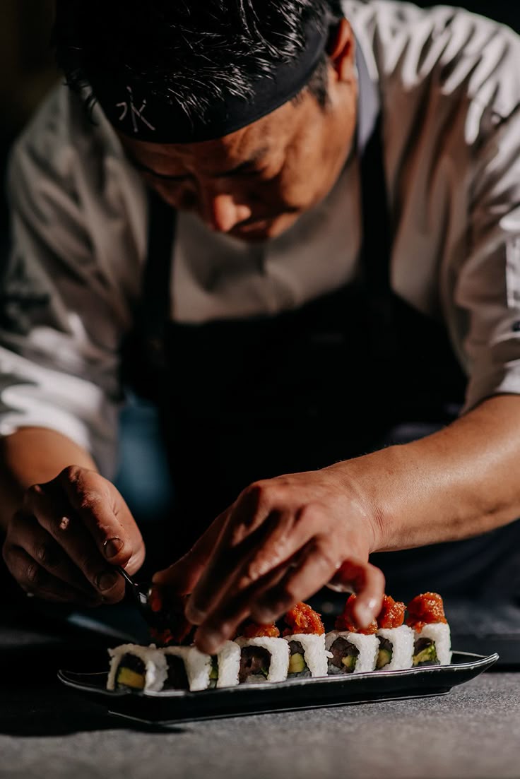 Sushi Chef making sushi
