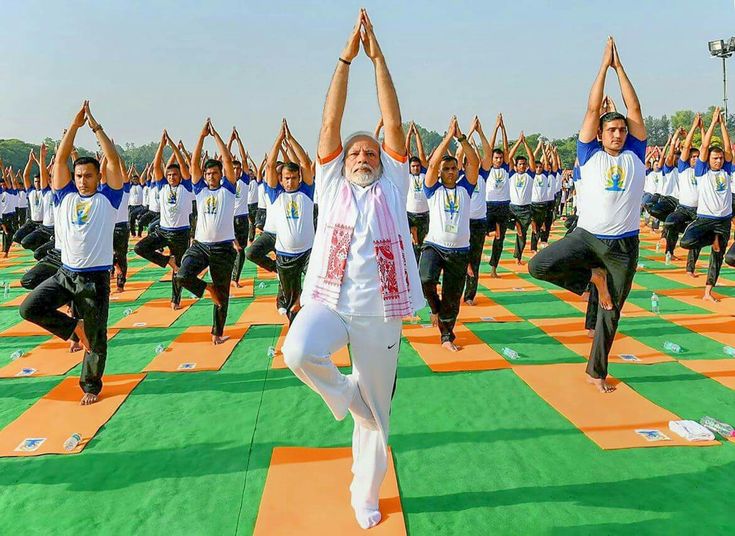 Prime Minister Narendra Modi performing yoga with a large group of people