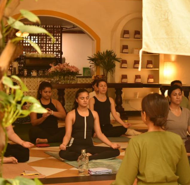A group of women performing yoga