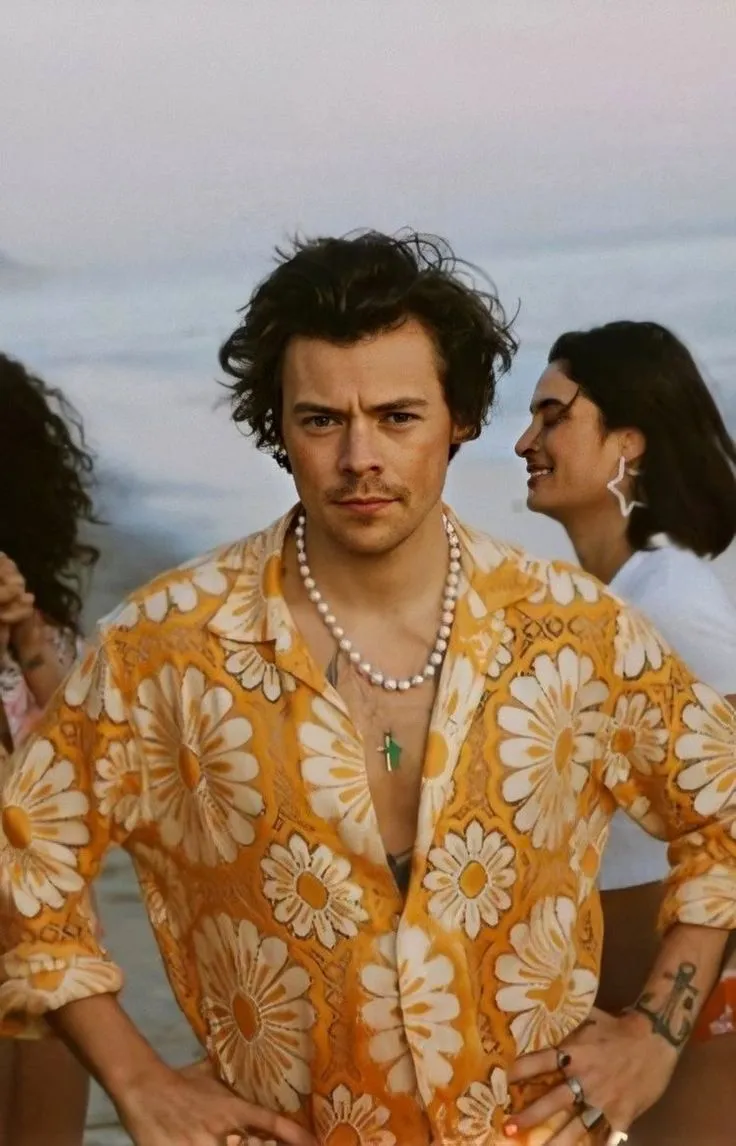 Harry Styles wearing a pearl necklace