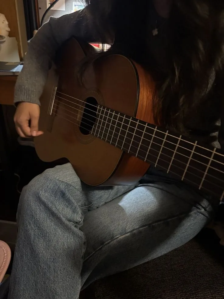 a person playing guitar